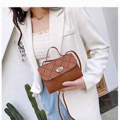 A small square bag with diamond-shaped stripes