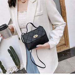 A small square bag with diamond-shaped stripes