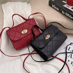 A small square bag with diamond-shaped stripes