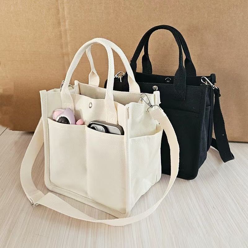 Canvas three-dimensional multi-pocket tote handbag