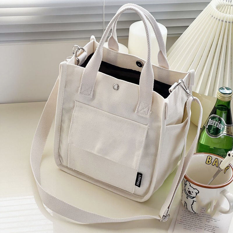 Canvas three-dimensional multi-pocket tote handbag