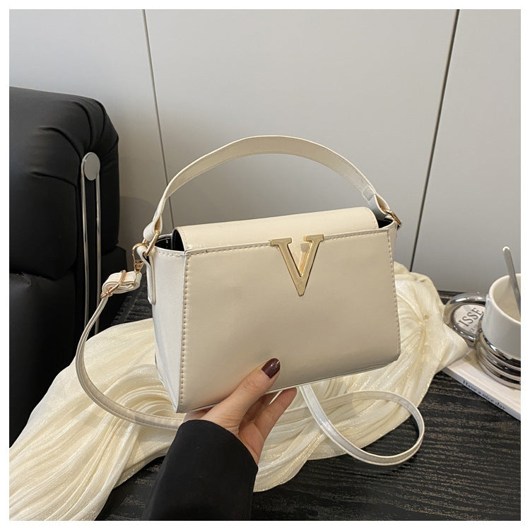 Outward appearance: Handheld single-shoulder crossbody handbag