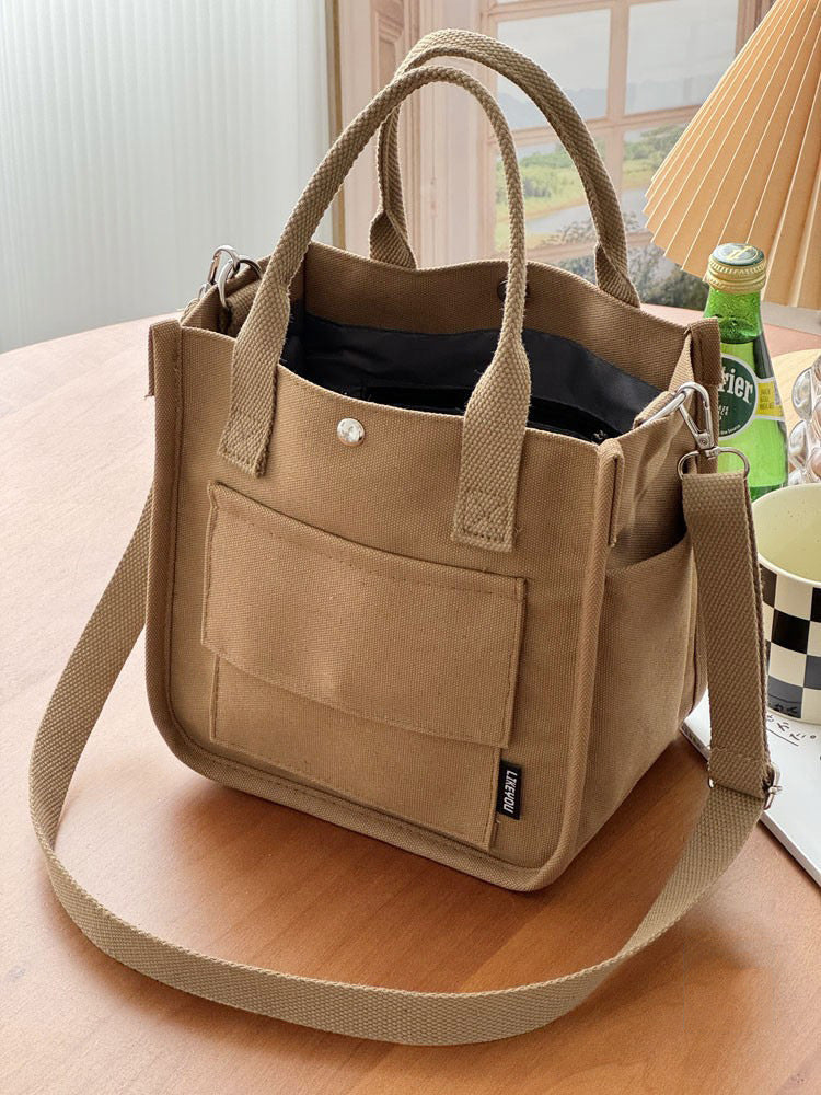 Canvas three-dimensional multi-pocket tote handbag